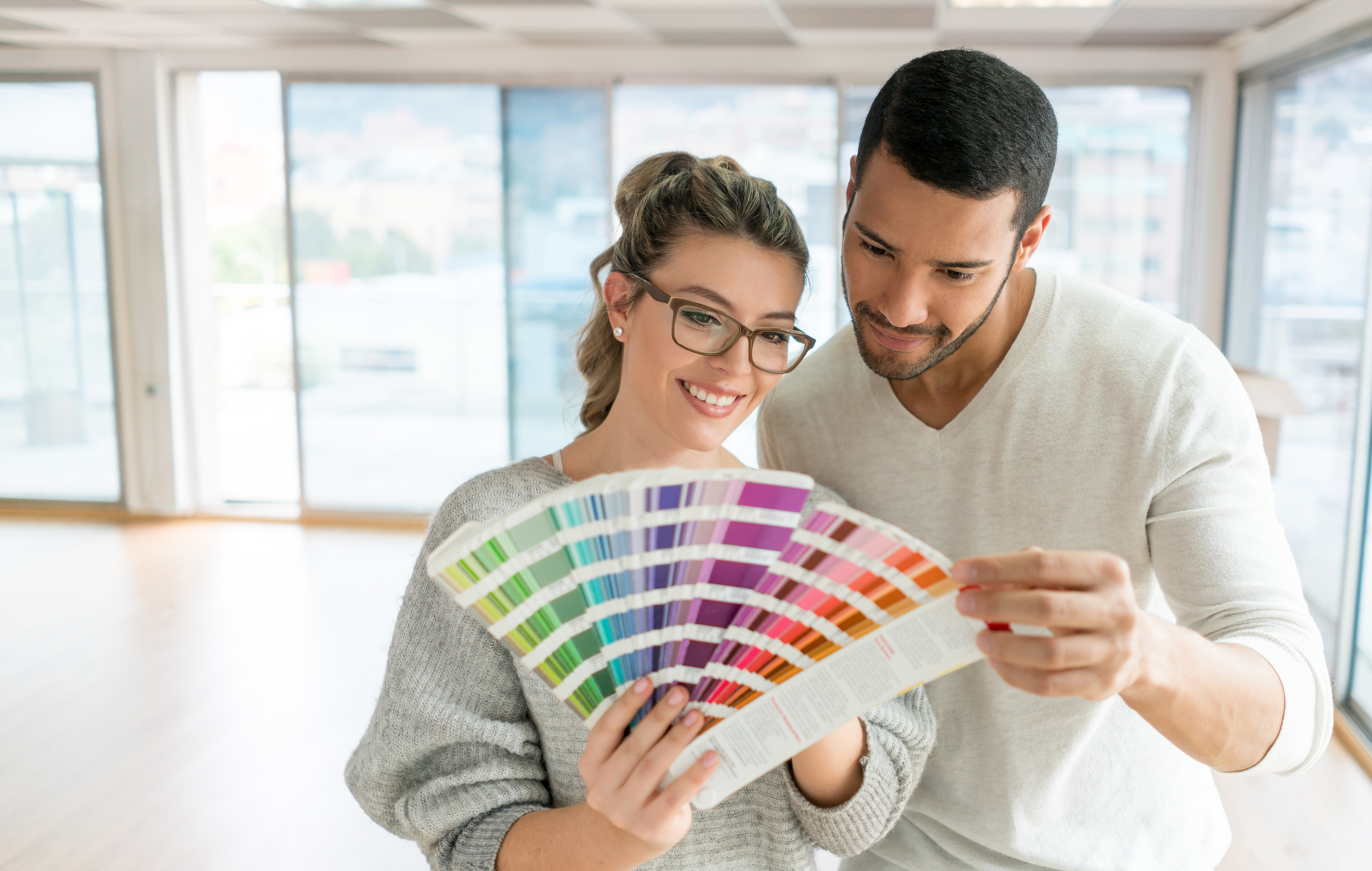 Couple painting their house